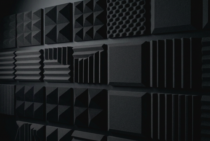 Soundwave blocking panels installed vertically on a wall